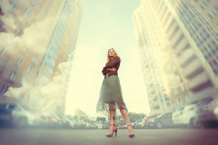 Double Exposure Full Body Portrait of Young Woman in the Big City. Blurred Effect, Image Toned.の写真素材
