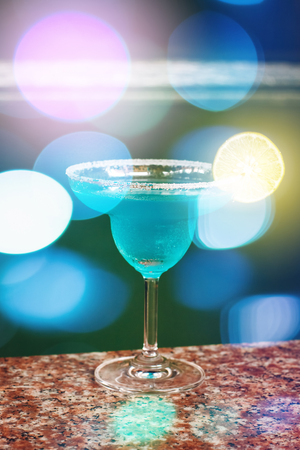 Blue Cocktail. Blurred Bokeh Lights. Selective Focus.の写真素材