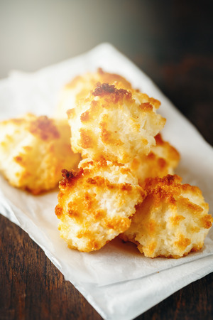 Fresh Baked Coconut Light Cookies on Old Wooden Table. Selective Focus. Close-up view.の写真素材
