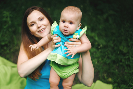 Beautiful Happy Mother and Daughter Together in Park