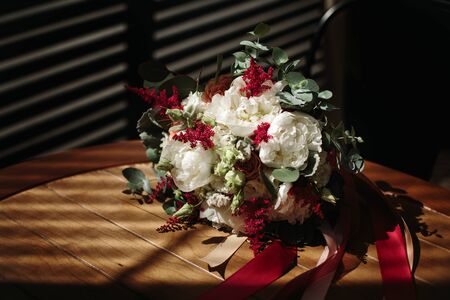 Luxuriant wedding bouquet of different flowers in rustic style. Space for text. Selective focus.の写真素材
