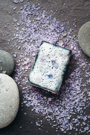 Harmony composition with soap, sea salt and massage stones on dark. Close-up.の写真素材