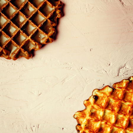 Homemade Waffles Close Up View on Pink Background. Selective Focus. Space for Text.の写真素材