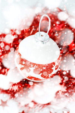 Bright Setting with Christmas Tree Decorations under Drawn Snow Close up. Selective Focus.の写真素材