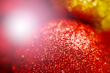 Red and Gold Color Background with Blurred Defocused Christmas Lights. Selective Focus.の写真素材