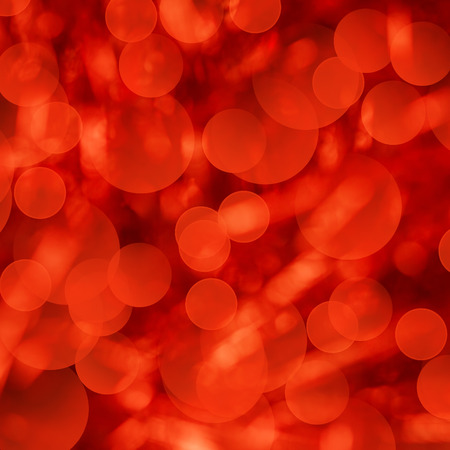 Red Color Background with Defocused Christmas Bokeh Lightsの写真素材