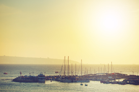 Sea travel background. Sunset at the sea port, toned.の写真素材