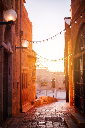 Old city Jaffa near Tel-Aviv, Israel, sunset light on old stone narrow street, selective focusの写真素材