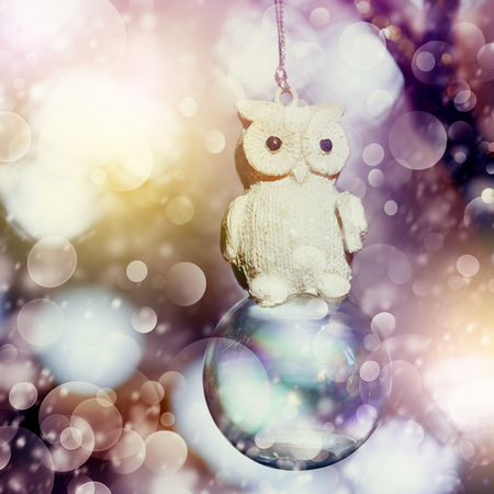 Snowy Christmas decoration with vintage owl, bright and lightの写真素材