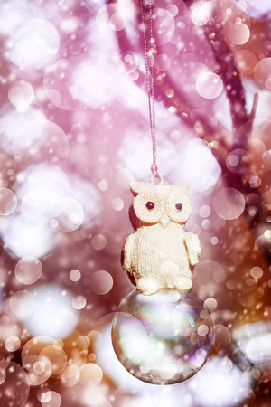 Snowy Christmas decoration with vintage owl, bright and lightの写真素材