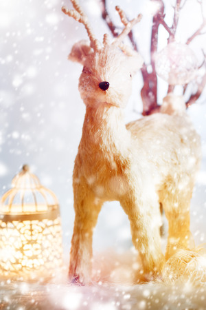 Christmas Background with Fairy Tale Deer and Drwan Snow. Selective Focus.の写真素材