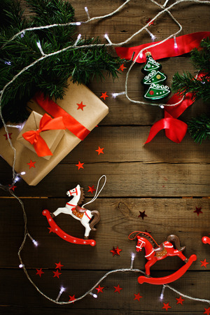 Christmas composition with Xmas lights and Christmas vintage toys. Top view, great for text.の写真素材