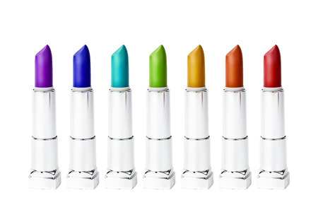 Set of rainbow multicolored lipstick tubes isolated on white background, close-up. Rainbow tints concept.の写真素材