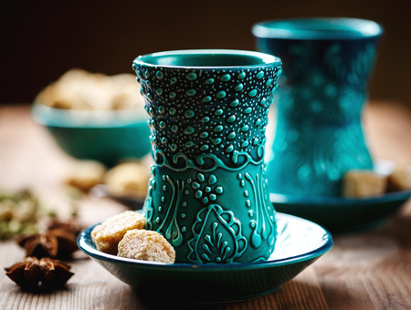 Authentic blue dishware, masala tea or hot drink with spices, selective focusの写真素材