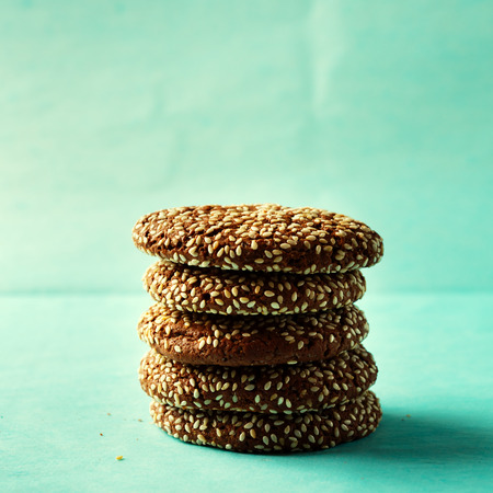 Stack of chocolate cookies with sesame, homemade pastry for healthy breakfastの写真素材