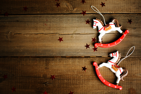 Vintage toy horse on wooden background. Christmas decorations.の写真素材