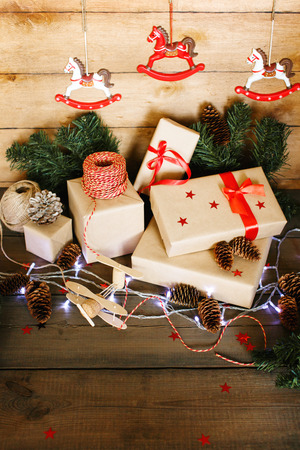 Handmade Christmas composition on wooden background. Christmas toys and presents.の写真素材