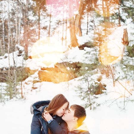 Couple kissing outdoors in winter holidaysの写真素材