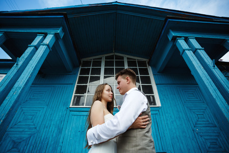 Awesome young wedding couple embracing and having funの写真素材
