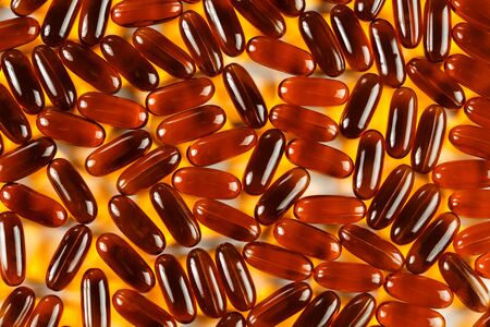 Gel capsules scattered on white background, top view, selective focusの写真素材