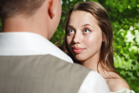 Bride looking at groom with love and tender, selectibe focusの写真素材