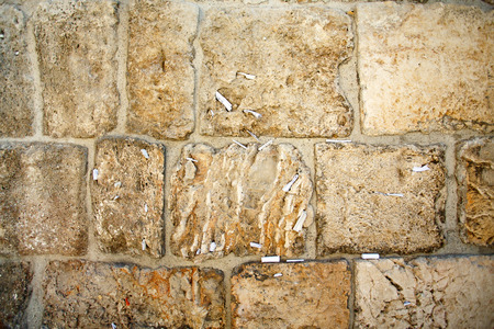 Close-up of notes to God in the Western Wall in Jerusalem, Israelの写真素材
