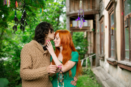 Beautiful romantic loving couple kissing, man and woman embracing, springtimeの写真素材