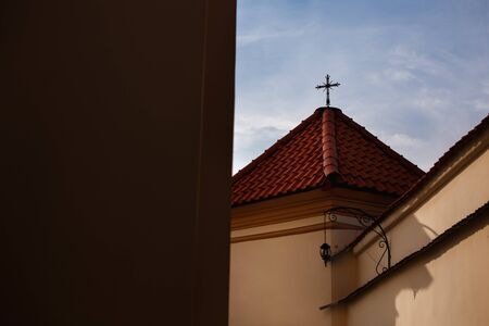 Christian symbol cross on the roof of catholic churchの写真素材