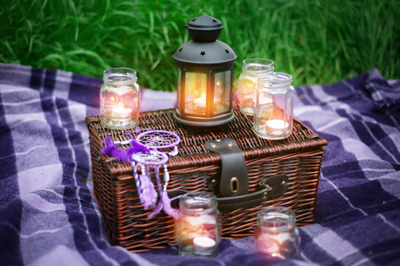 Romantic composition with candles in evening outdoorsの写真素材