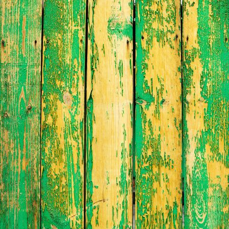 Old green wooden fence texture. Grunge cracked effect.の写真素材