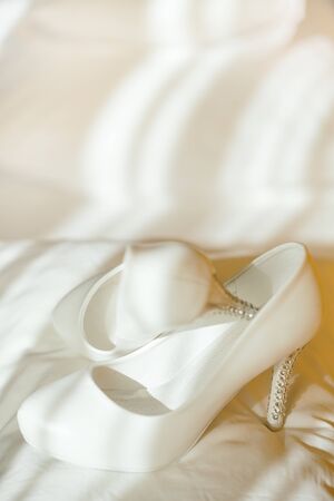 Delicate wedding shoes waiting for the bride, selective focusの写真素材