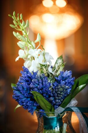 Luxurious bouquet with beautiful blue hyacinths in gorgeous interior, bridal flowers, close-upの写真素材