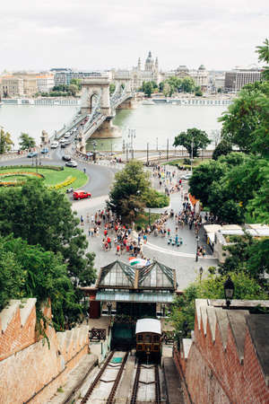 BUDAPEST, HUNGARY - July 23, 2019 - View from the Buda castle on the cable car famous Szechenyi chain bridge and square full of touristsのeditorial素材
