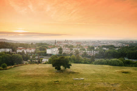 View on Krakow city landscape at the sunset from the Krakus (Krak) Mound in Poland. Tumulus, mythical resting place of Krakow's mythical founder, the legendary King Krakus.の写真素材