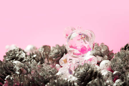 Christmas glamor gift card withh crystal bear toy on bright pinky background with copy spaceの写真素材