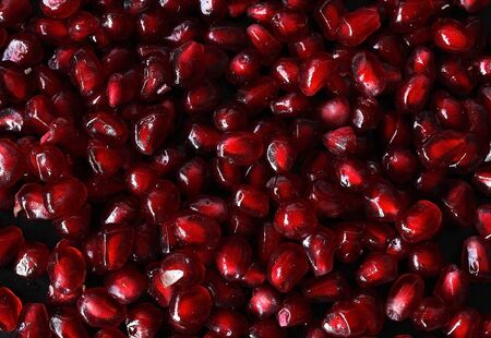 ?omegranate on black background. Fresh fruitの写真素材