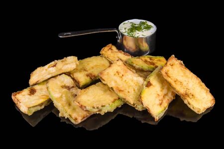 a gourmet greek zucchini with, dill and yogurt sauce  with reflection, isolated on black backgroundの写真素材