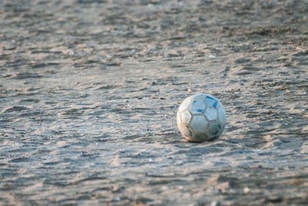 Cesenatico, November 1 2014: Abandoned ball in the sandの写真素材