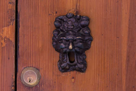 Old lock in a wooden door in Bologna, Emilia-Romagnaの写真素材