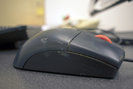 Work colleges filthy computer mouse, close upの写真素材