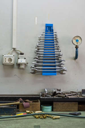 Wall in the mechanic workshop,all identifiable brand names have been removed.