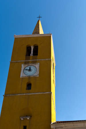 Tower of the church of St. George in Lovran,Croatiaの写真素材