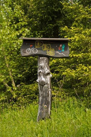 mountain bike and hiking trail signpost  made of woodの写真素材