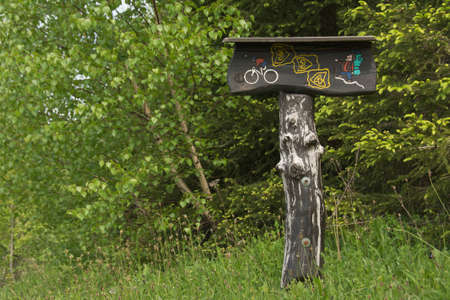 mountain bike and hiking trail signpost  made of woodの写真素材