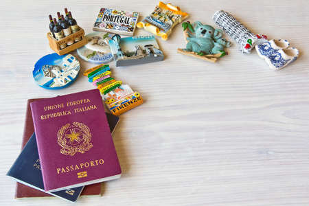 various passports and souvenir magnets from several world country