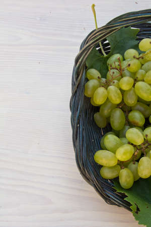Bunch of grapes in a basketの写真素材