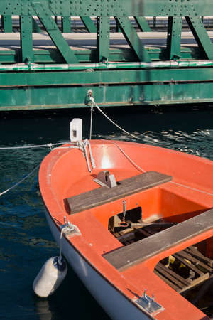 orange boat and green bridge,orange boat tied to the iron green bridgeの写真素材