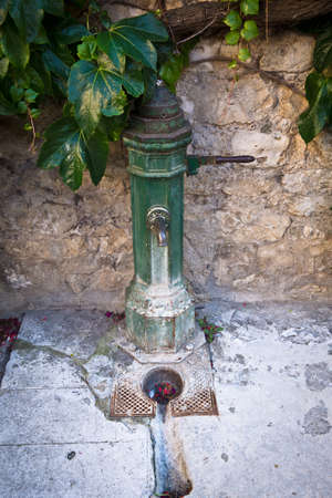 Provencal water pumpの写真素材