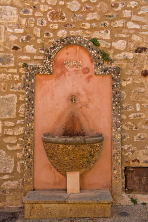 antique fountain in Roussillon, Provence , Franceの写真素材