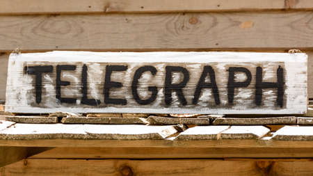 Telegraph inscription on the wooden boardの写真素材